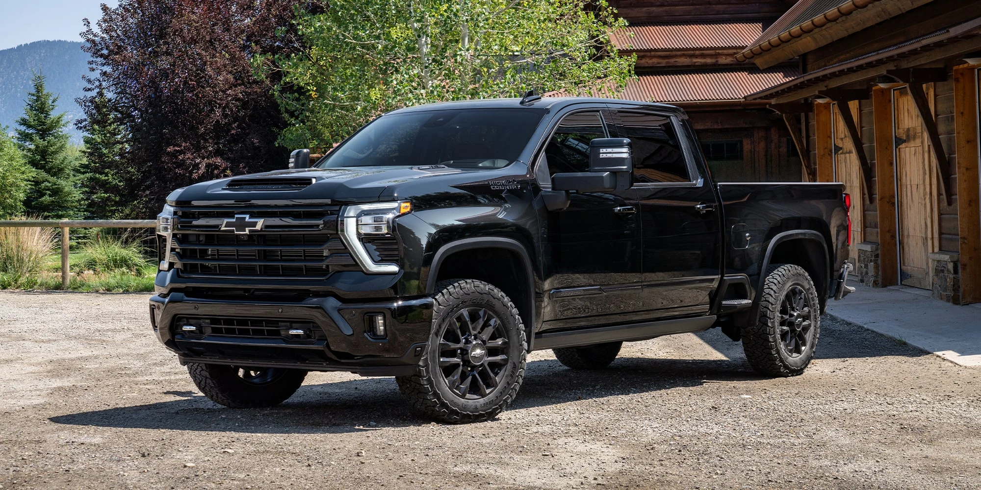 Black Chevrolet Silverado HD parked outside a house