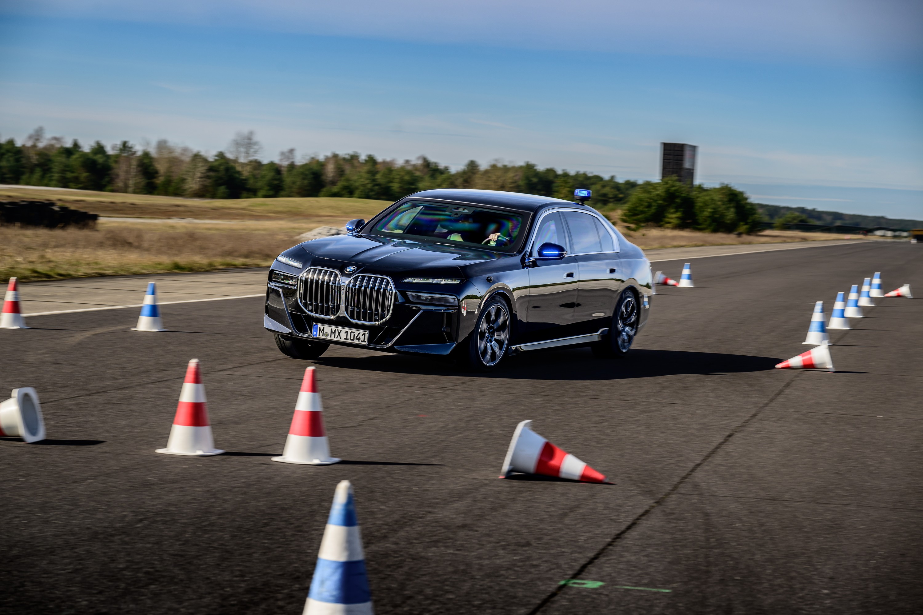 BMW 760i driving P90543769