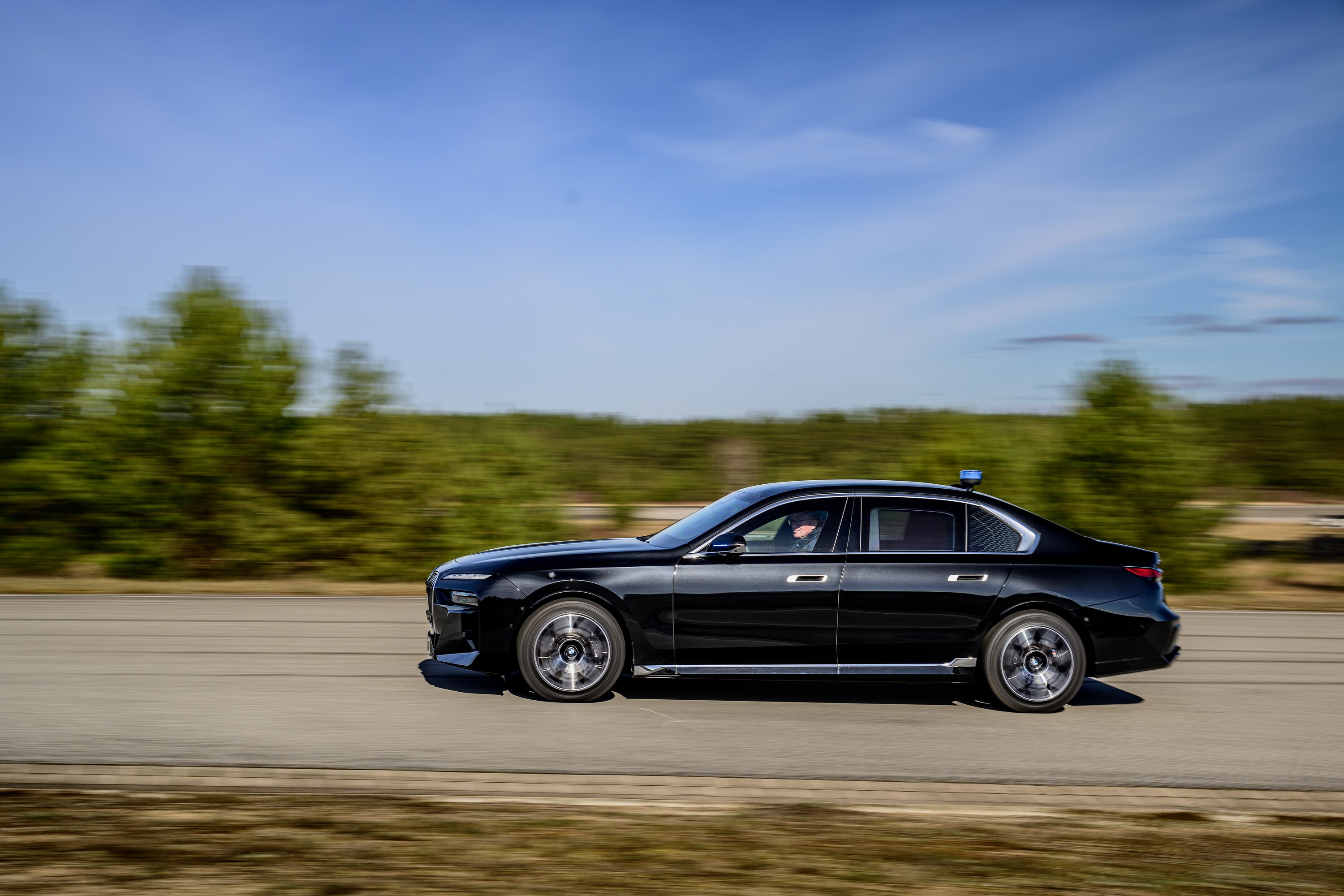 BMW 760i driving P90543760