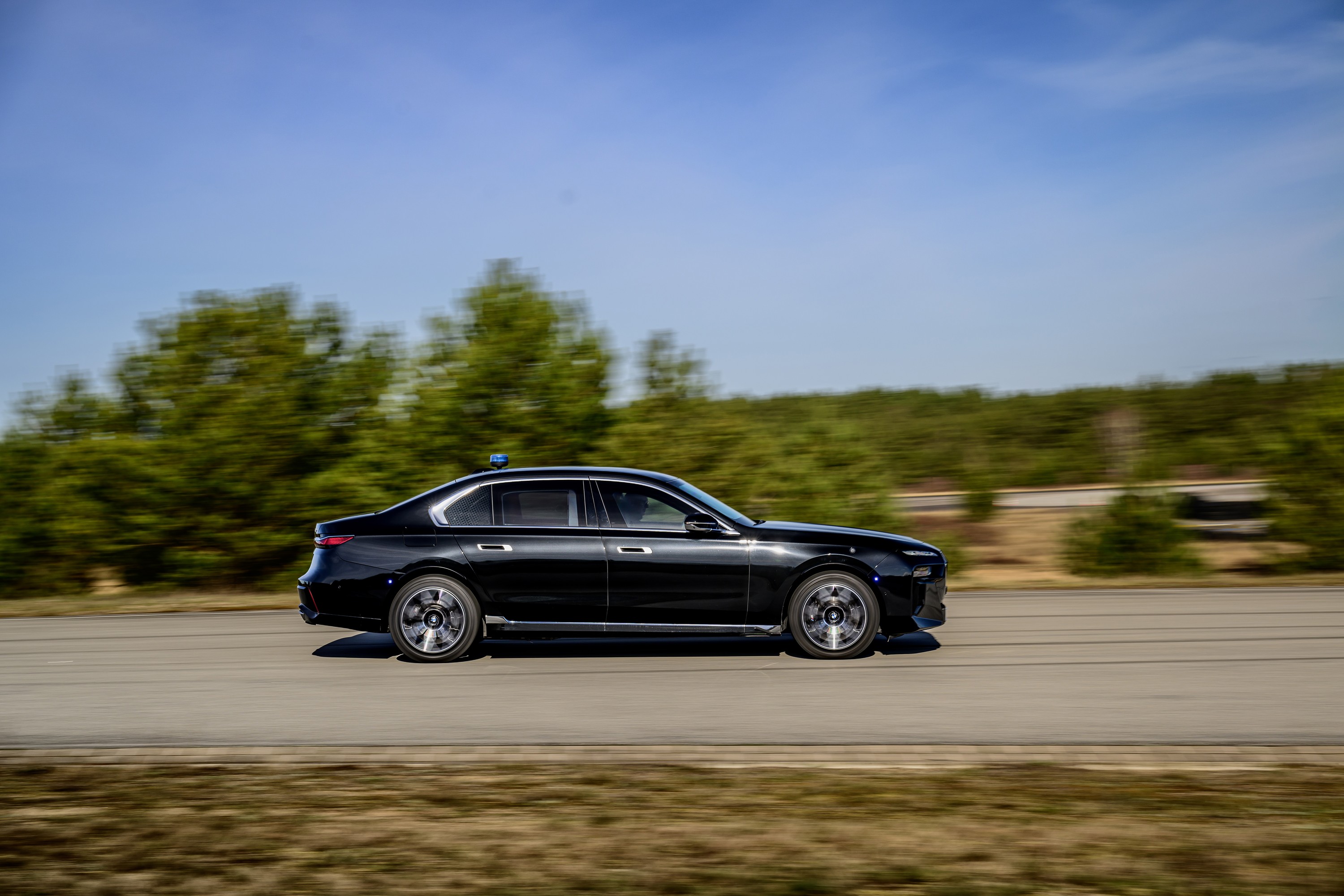 BMW 760i driving P90543759