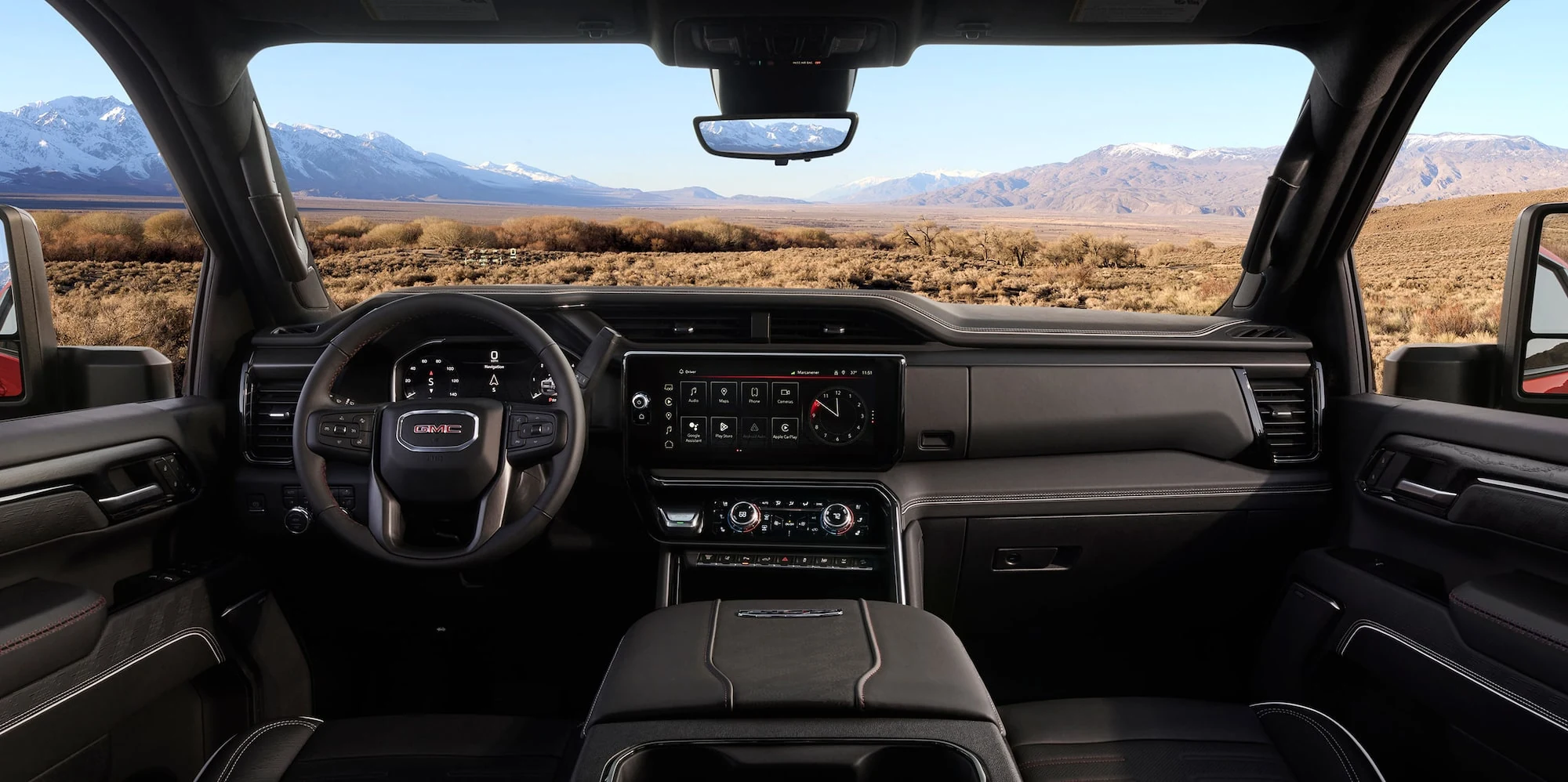 GMC Sierra HD AT4X dashboard with mountains visible through the windshield