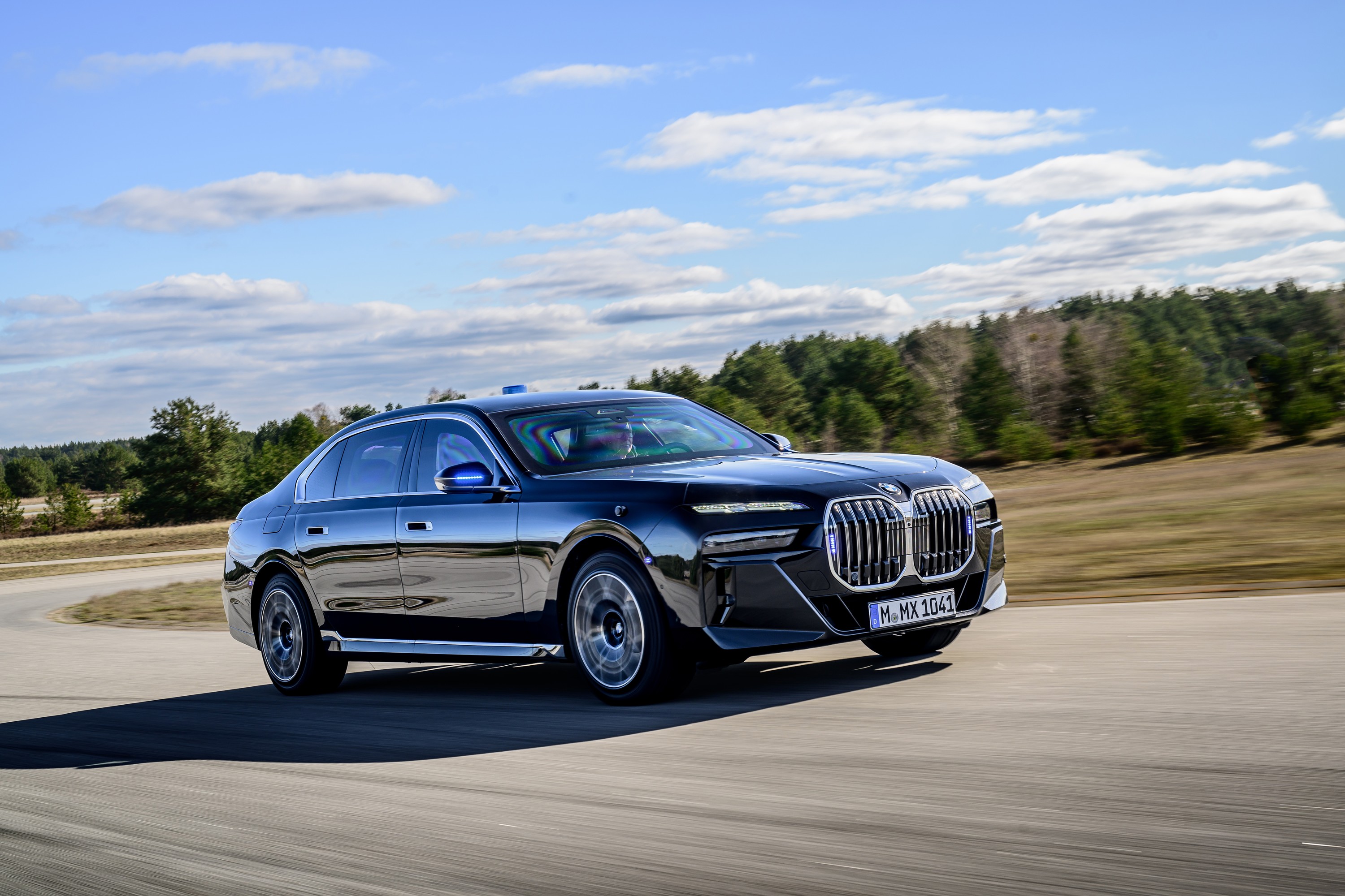 BMW 760i driving P90543753